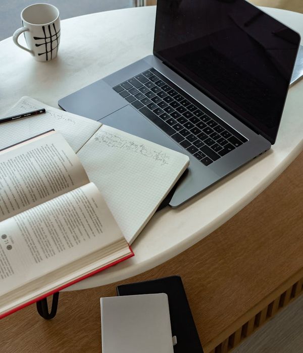 Professional working comfortably at a modern desk with good posture.